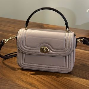 Light Pink and Maroon Coach bag with gold hardware